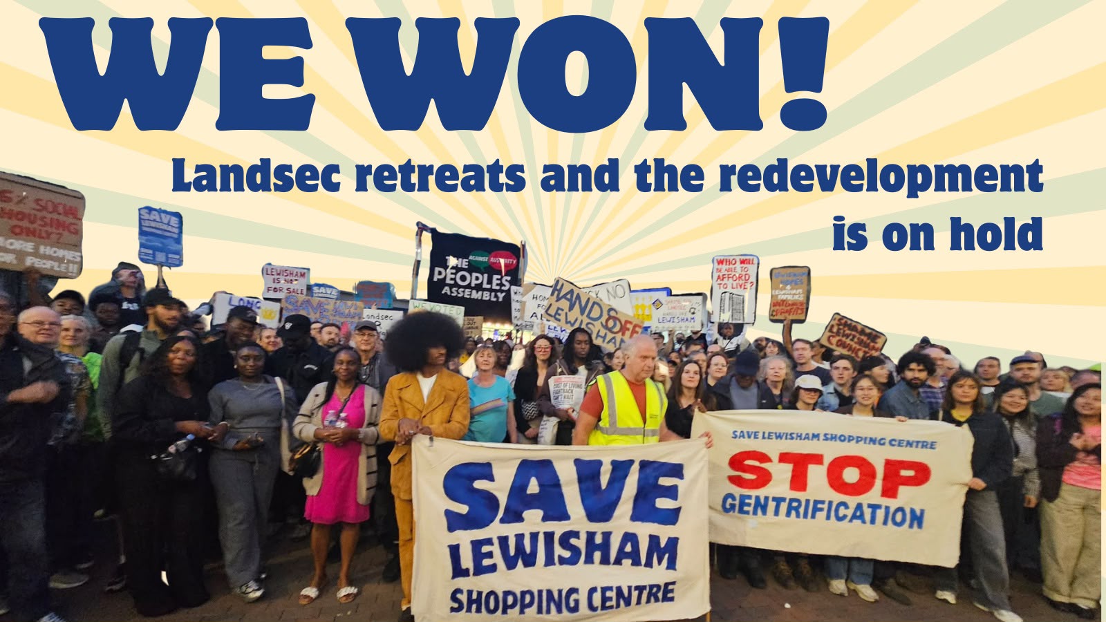 We won! Landsec retreats and the redevelopment is on hold. Campaigners gather with Save Lewisham Shopping Centre and Stop Gentrification banners.
